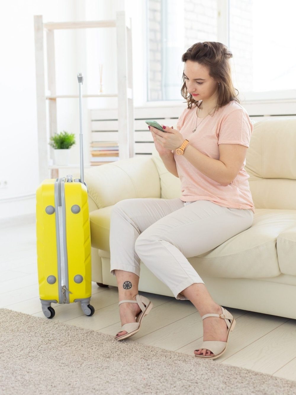 trip-travel-and-vacations-concept-woman-with-yellow-suitcase-is-waiting-for-the-taxi-1.jpg